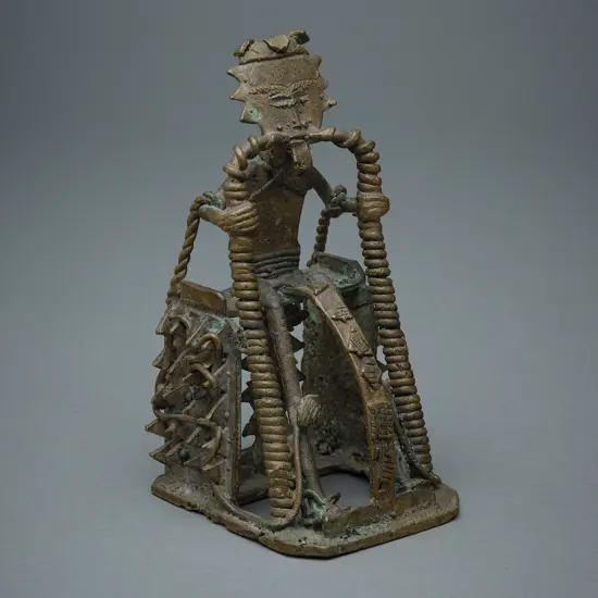 African brass and wire-formed seated figure,